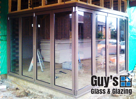 Whether the doors are open in fine weather or securely fastened into place as sturdy impenetrable walls our bifold doors are the only choice! The view from outside looking in with doors closed.