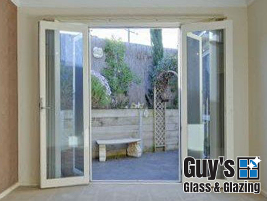 Aluminium french doors with energy efficient glass opening into the room