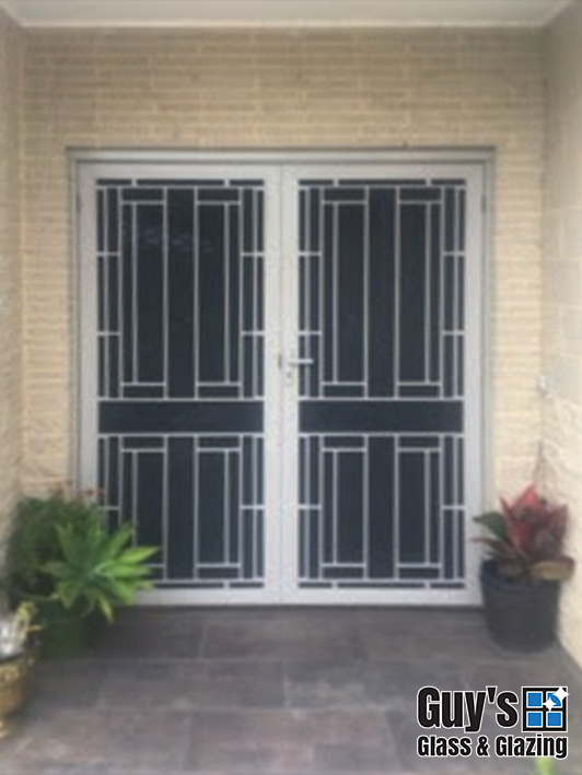 Double doors after Colonial style security doors installed